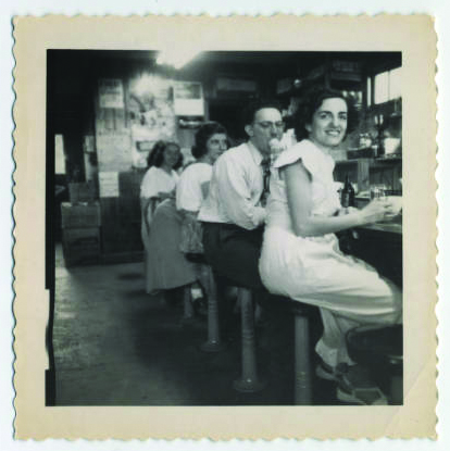 Young people at a soda fountain on the way to Emanuel Cohen Center, Camp Hinckley, Minnesota
