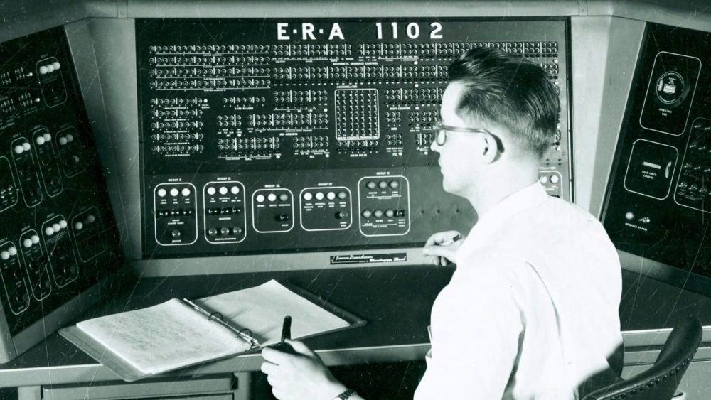 man from the 1950s in front of super computer