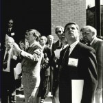 Photo- Weiming Lu stands at the center of a group of people, acting as host to an international delegation inspecting the dramatic transformations in Lowertown, St. Paul Weiming Lu papers, N279, Northwest Architectural Archives