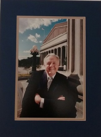 Portrait of Curt Carlson in front of Carlson Companies headquarters, circa 1995.