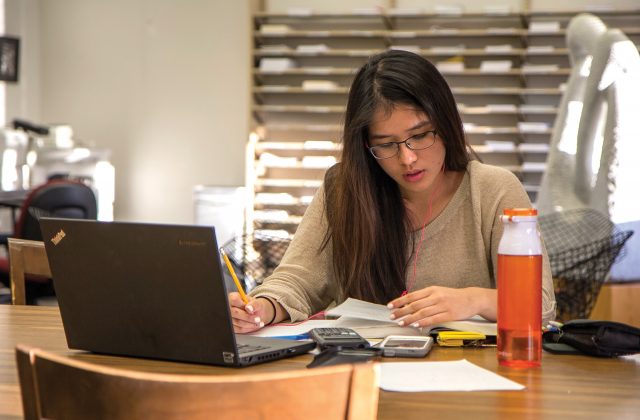 A student prepare for finals at the Math Library in Vincent Hall.