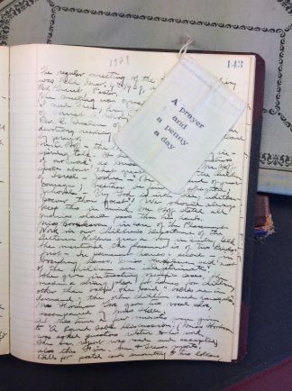 Lutheran Welfare Society Women's Auxiliary ledger page showing handwritten notes and a small cloth page that says “A Prayer and a Penny a Day.”
