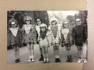 Lutheran Social Services of Minnesota undated black and white photograph of 7 children in chicken costumes with a caption that says “Take us to the Armory!”