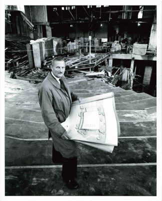 Tyrone Guthrie stands in the Guthrie Theater auditorium while it is mid-construction. Photographer unidentified. Image courtesy of the Guthrie Theater Records, Performing Arts Archives, University of Minnesota Libraries.