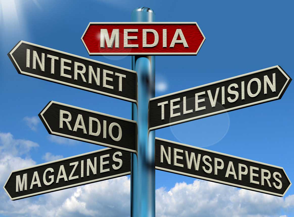 Sign post featuring various media formats, for example Magazines, Newspapers, Television, Internet.