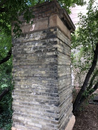 A remnant of a Northrop Field pillar at the southwest corner of the Armory.
