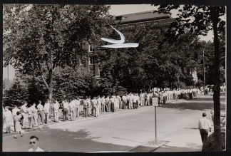 Taken August 4, 1947, this photo shows students lined up to register for engineering classes in the University's Institute of Technology, predecessor to the College of Science and Engineering. One estimate put the number of students expected to register that day at 6,000.