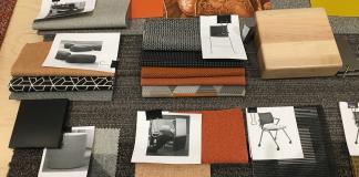 Photo of orange-themed fabric swatches and furniture finishes.