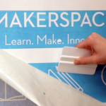 Photo of person using a stencil made at the Makerspace