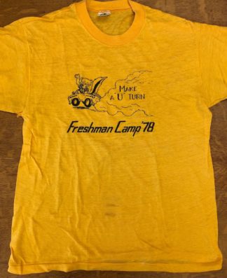 Yellow t-shirt with a cartoon drawing of Goldy Gopher driving a car with the text "Make a 'U' turn Freshman Camp 1978."