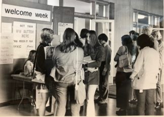 Photograph: Students attending Welcome Week in 1971 at an informational table.