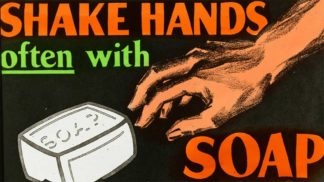 Public health awareness poster with a bar of soap and a hand.