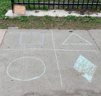 Chalk drawing of math on a sidewalk