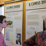 People viewing the Campus Divided exhibit