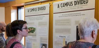 People viewing the Campus Divided exhibit