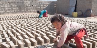 Little Girl Turning Drying Bricks, Nepal