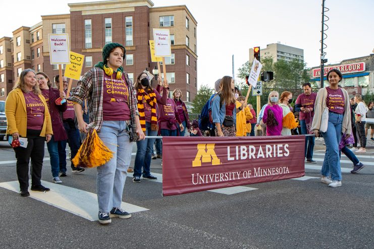 homecoming parade 2021 - walking with the libraries banner