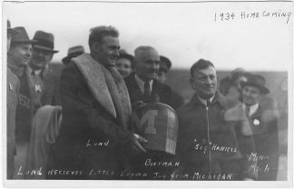 Bernie Bierman, Francis Lund and Sig Harris with the Little Brown Jug, Minneapolis, Minnesota; 1934 Homecoming