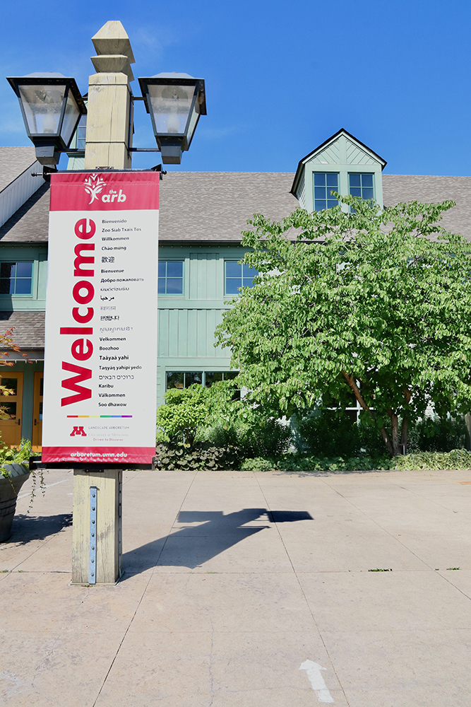 welcome banner outside the exhibit building with a blue sky above