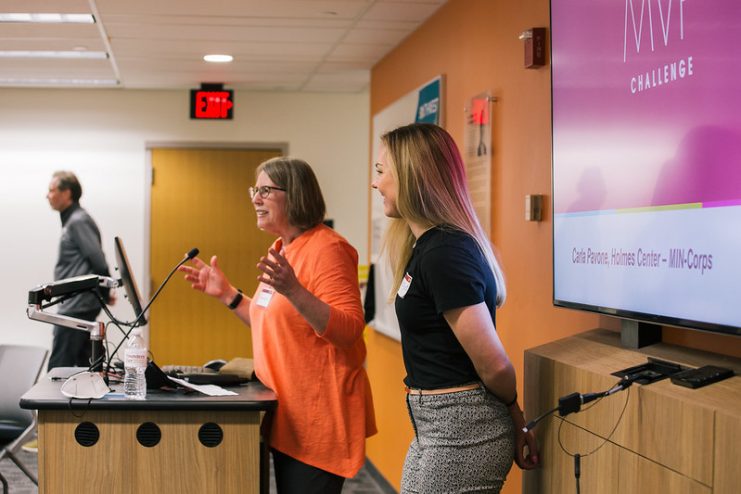 a staff member introduces a student presentation at the Toaster