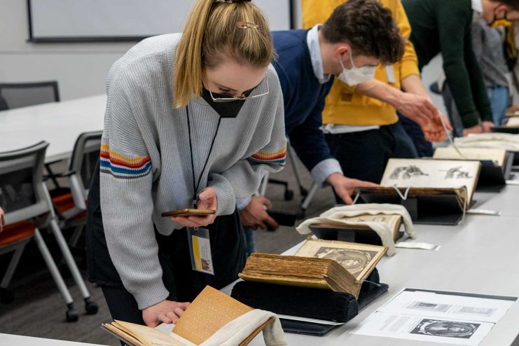 Heidelberg students examine rare books in the Wangensteen Historical Library.