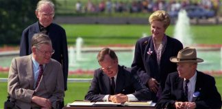 President George H. W. Bush Signs the Americans with Disabilities Act, July 26, 1990.