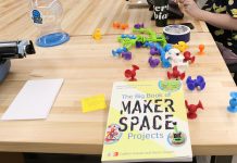 A table in the makerspace with project supplies and The Big Book of Maker Space Projects