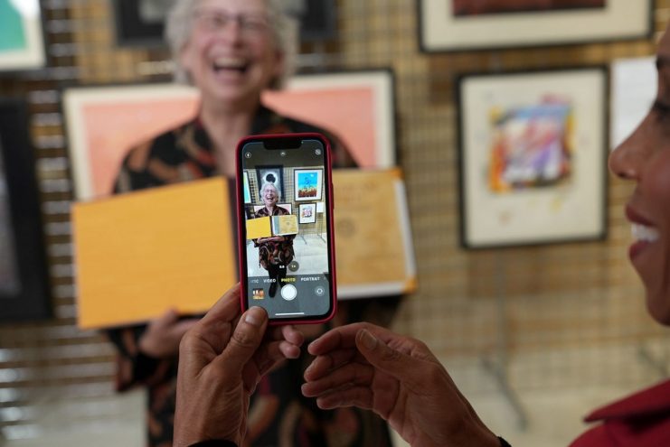 Andrea Davis Pinkney captures a cellphone picture of Lisa Von Drasek.