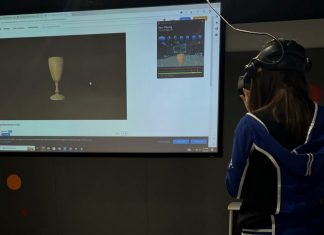 A library staff member experiences the 3D model in virtual reality