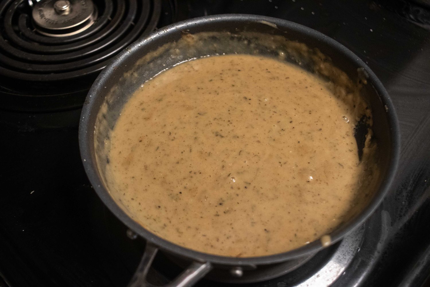 Gravy made from rendered fat, stew stock, heavy cream, and a roux.