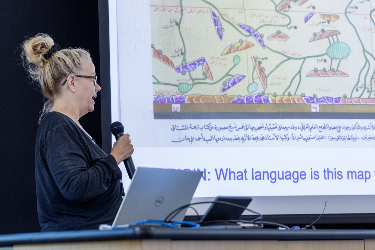 Kari Rise, an IB Geography, human geography, and criminal justice teacher at Highland Park Senior High School, shares her project on map literacy, on Thursday. Aug. 17, 2023. (Photo/Adria Carpenter)
