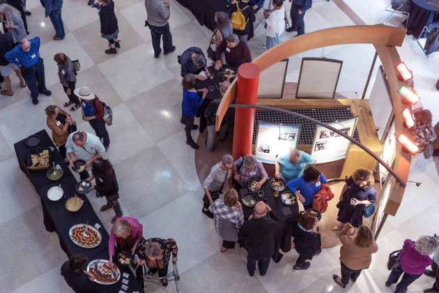 Guests gather, talk, and eat foot at the Symbolic Significance exhibit opening event on Monday, Sept. 11, 2023. (Photo/Adria Carpenter)