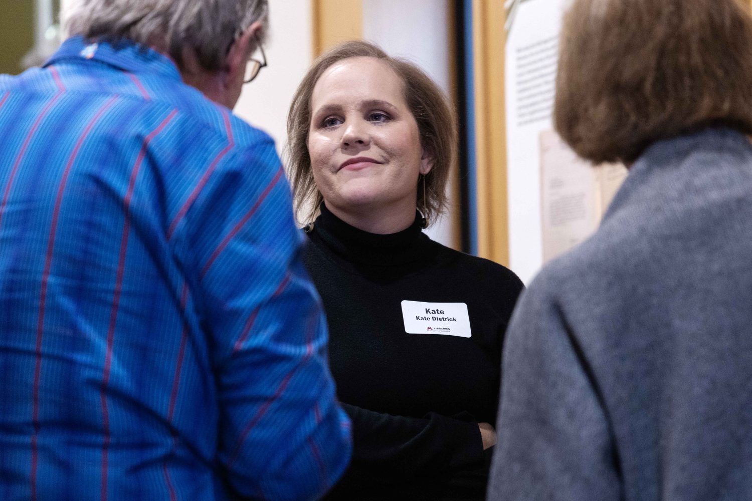 Kate Dietrick, the archivist for the Upper Midwest Jewish Archives, talks with guests at the Symbolic Significance exhibit opening event on Monday, Sept. 11, 2023. (Photo/Adria Carpenter)